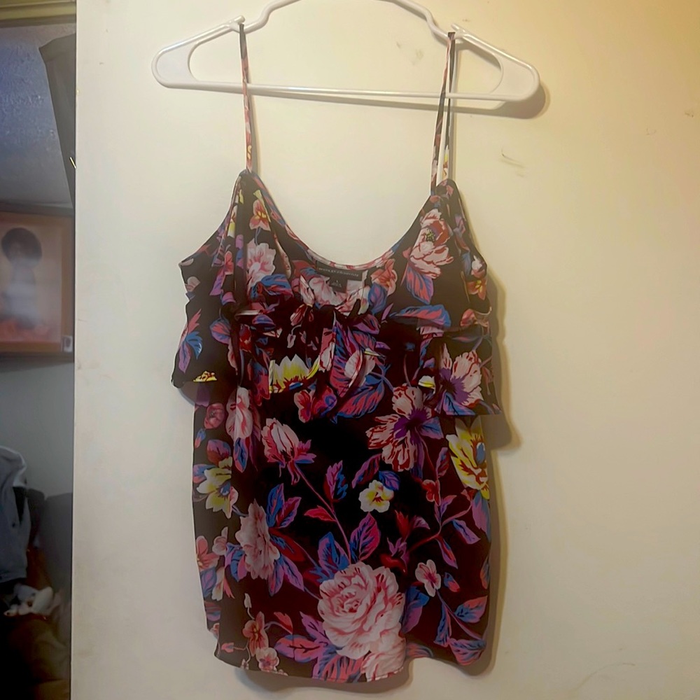 Summer blouse with flowers on a black background